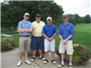 Four Golfers Pose for a Group Photo