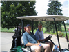 Two Golfers Share a Golf Cart